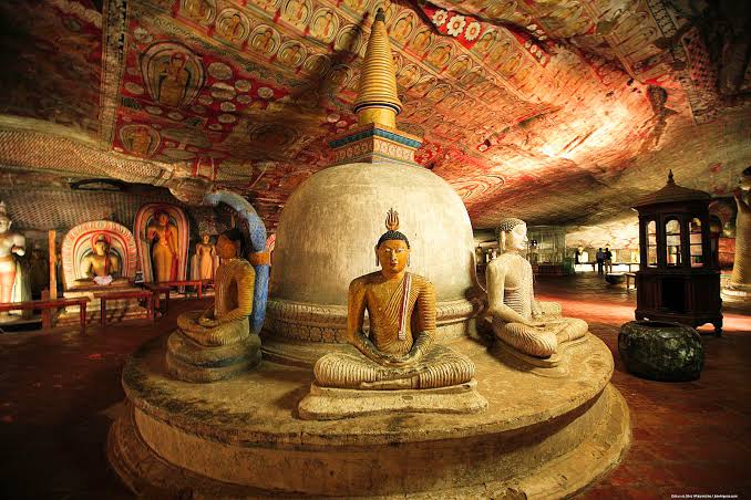 Centuries-old Buddha statues carved in rock at Dambulla caves